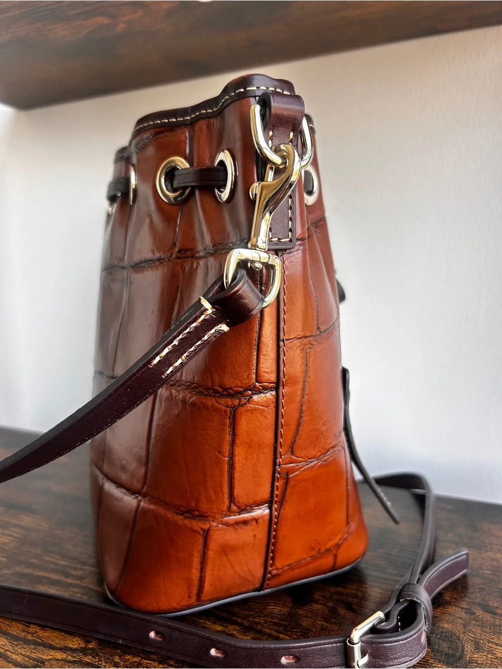 Dooney & Bourke Croc Embossed Leather Drawstring Bucket Crossbody Cognac